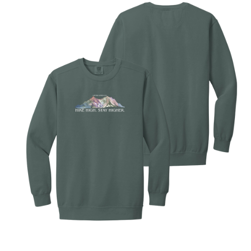 Green sweatshirt with mountain graphic and text on a white background