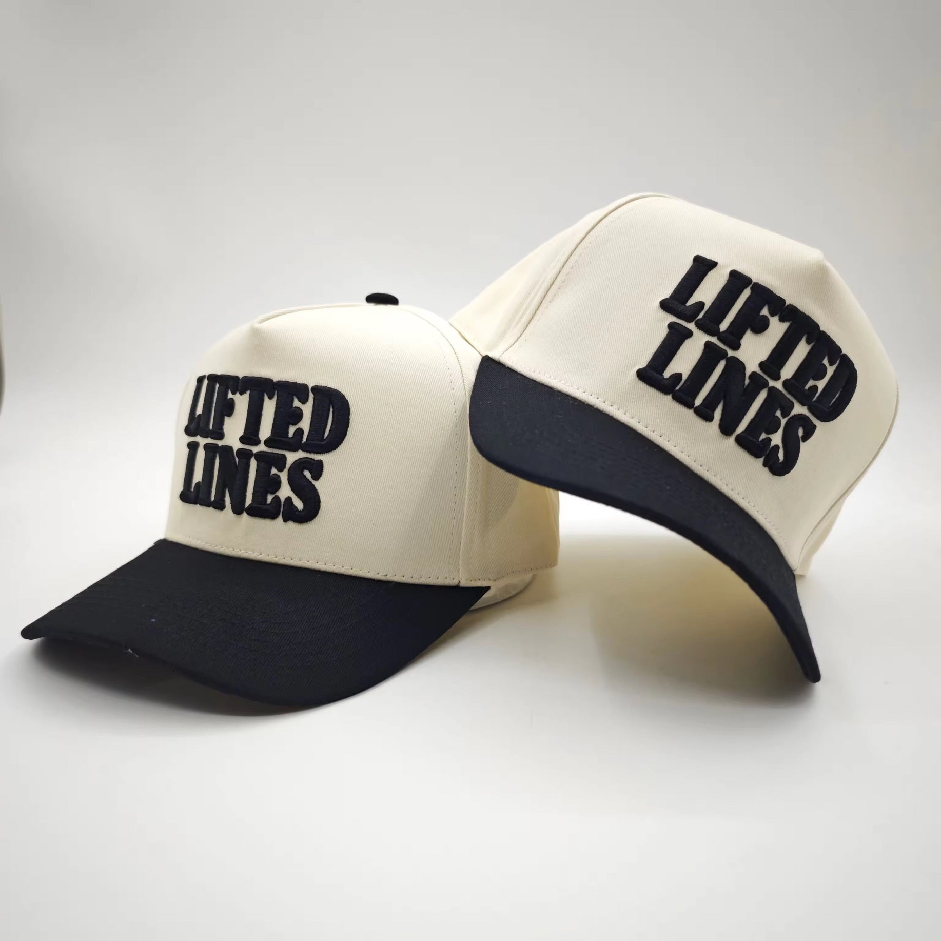 Two caps with 'LIFTED LINES' text on a white background